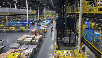 A worker walks during Cyber ​​Monday operations inside the Amazon fulfillment center in Robbinsville, New Jersey.