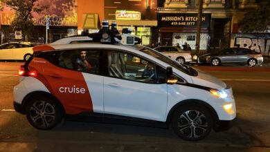 Associated Press journalist Michael Liedtke sits in the back of a Cruise driverless taxi that picked him up in San Francisco's Mission district.