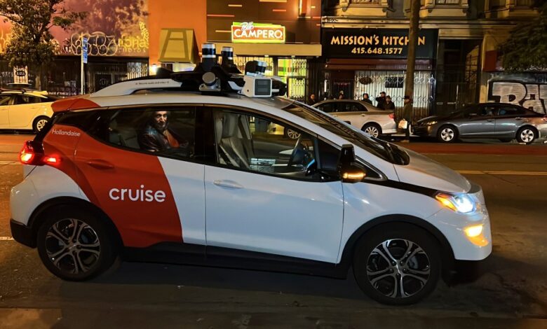 Associated Press journalist Michael Liedtke sits in the back of a Cruise driverless taxi that picked him up in San Francisco's Mission district.