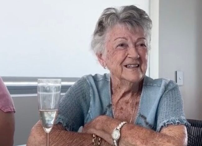 Grandmother smiles at table