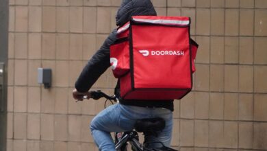 A Doordash worker riding a bike.