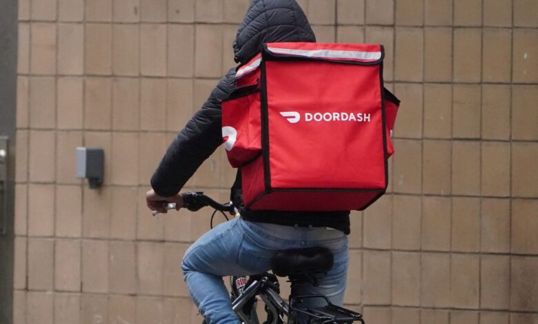 A Doordash worker riding a bike.