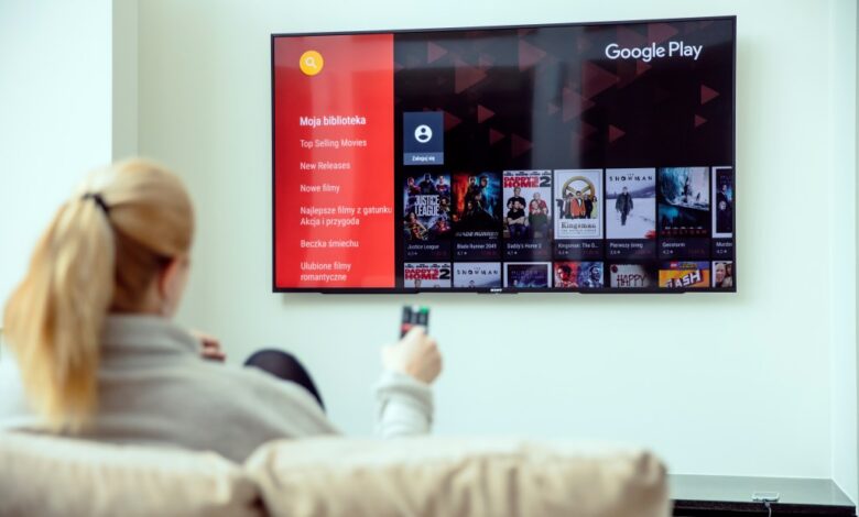 WROCLAW, POLAND - APRIL 03rd, 2018: Woman is using google play on her TV. Google Play is a digital distribution service operated and developed by Google.