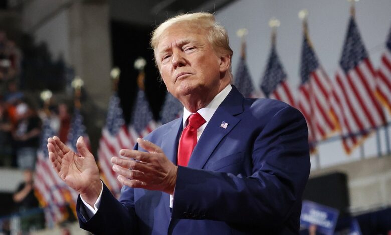 Former President Donald Trump clapping