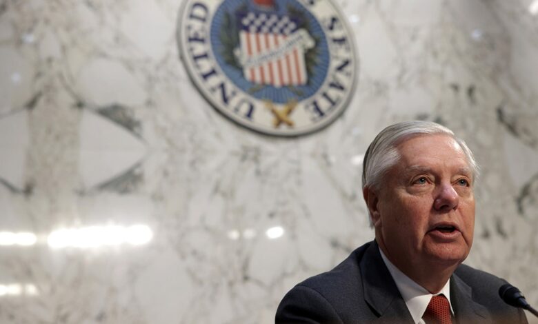 Sen. Lindsey Graham speaking (right corner of the photo) chest up, in front of marble wall, United States Senate sign behind him