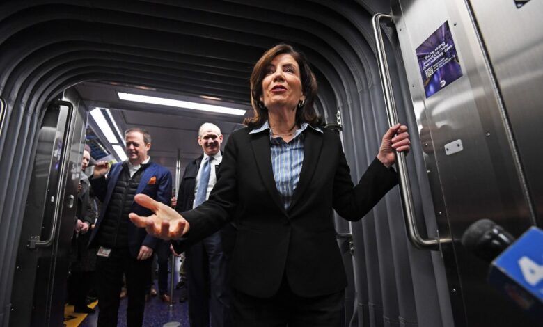 New subway cars with NY Governor Kathy Hochul and MTA Chairman Janno Lieber standing in a subway.