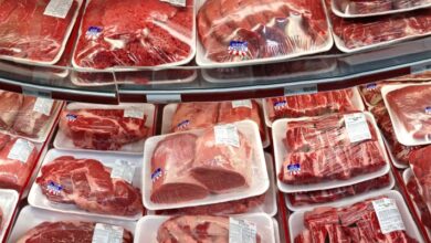 Various cuts of beef and pork in plastic wrap on a shelf at a discount market in Arlington, VA.