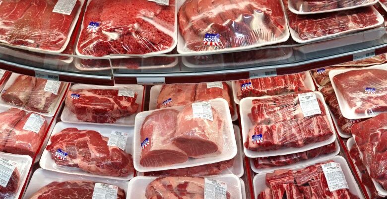 Various cuts of beef and pork in plastic wrap on a shelf at a discount market in Arlington, VA.