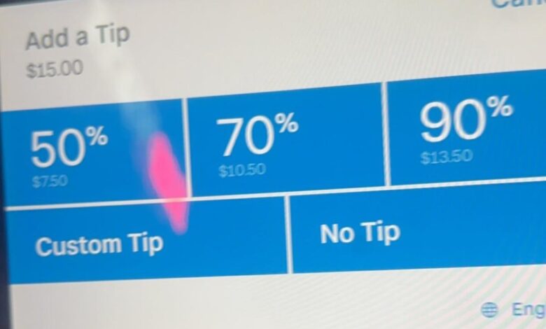 The tablet displaying the extortionate tip amounts.