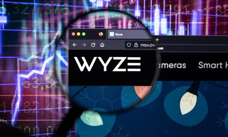 WYZE company logo on blurry stock market development background