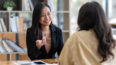 Two happy asian businesswoman talking and consulting working together in the office.