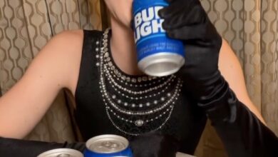 Dylan Mulvaney holding a Bud Light can