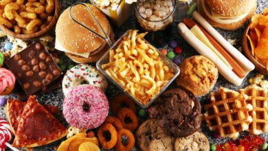 Unhealthy products. food bad for figure, skin, heart and teeth. Assortment of fast carbohydrates food with fries and cola