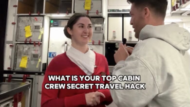 A man and a woman sitting in a room, the woman demonstrating how to reduce the feeling of turbulence on a plane by moving like a jellyfish in your seat.