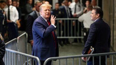 Former U.S. President Donald Trump gestures outside the courtroom in New York State Supreme Court in New York City, U.S., February 15, 2024.