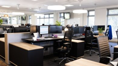 Open office space with desks, chairs, and computers