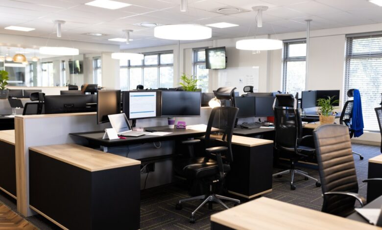 Open office space with desks, chairs, and computers