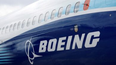 The Boeing logo is seen on the side of a Boeing 737 MAX at the Farnborough International Airshow, in Farnborough, Britain, July 20, 2022.