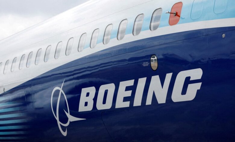 The Boeing logo is seen on the side of a Boeing 737 MAX at the Farnborough International Airshow, in Farnborough, Britain, July 20, 2022.