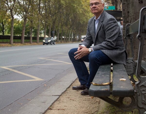 Tim Keller sitting next to a banana peel.