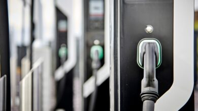 A bank of electric car chargers in black and white