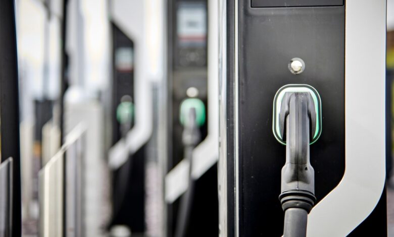 A bank of electric car chargers in black and white