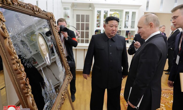 This picture taken on June 19, 2024 and released on June 20, 2024 from North Korea's official Korean Central News Agency (KCNA) via KNS shows North Korea's leader Kim Jong Un presenting a gift to Russia's President Vladimir Putin.