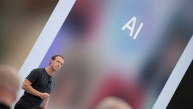 Meta CEO Mark Zuckerberg delivering a speech with artificial intelligence acronyms displayed on a large screen behind him at the Meta Connect event