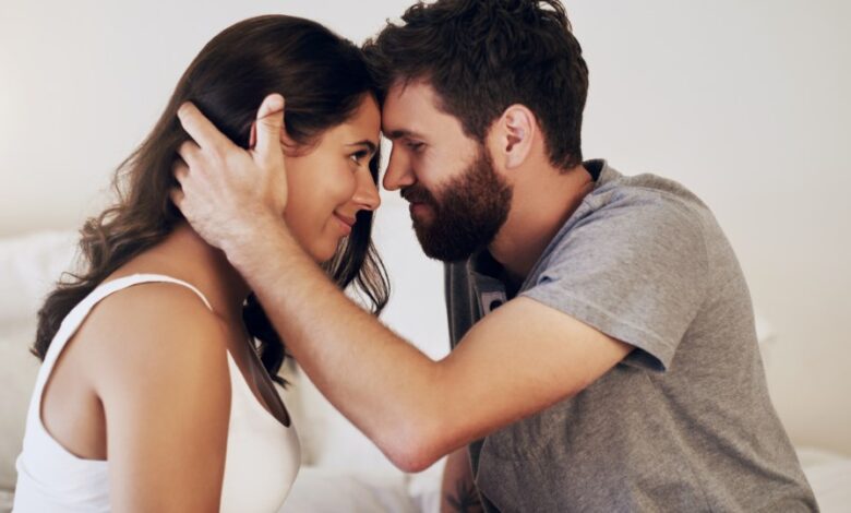 Shot of an affectionate young couple sharing a romantic moment in the bedroom at home