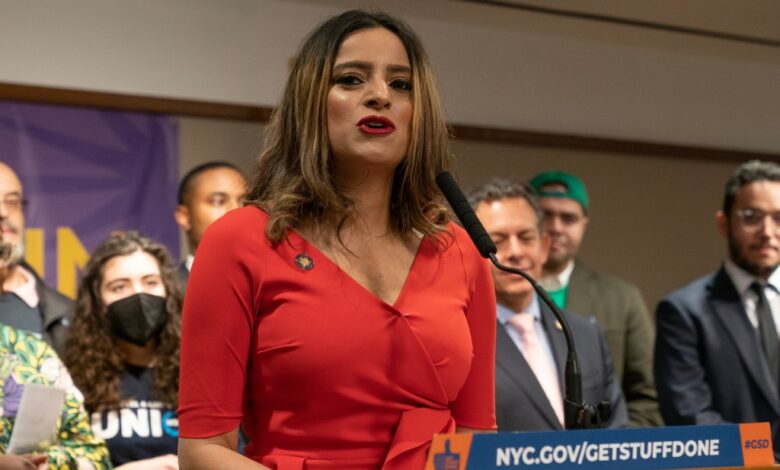 Assembly member Jenifer Rajkumar speaking at a rally in support of Child Tax Credit and Earned Income Tax Credit expansion at a podium with a microphone