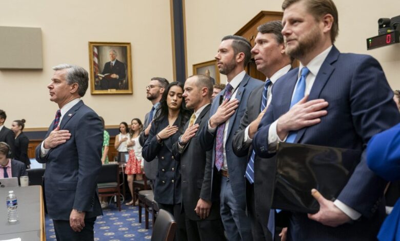 FBI Director Christopher Wray pledges allegiance prior to testifying before the House Judiciary Committee on Capitol Hill in Washington, DC on Wednesday, July 24, 2024.