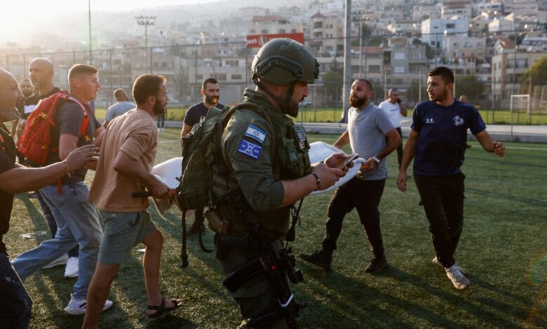 Israeli security forces and medics transport casualties from a site where a reported strike from Lebanon fell in Majdal Shams village in Israel on July 27, 2024. (Photo by JALAA MAREY/AFP via Getty Images)