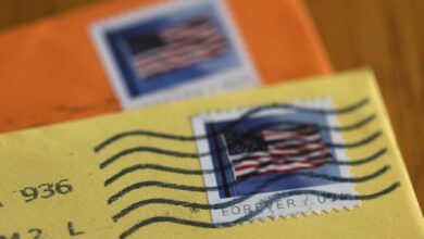 In this photo illustration, U.S. Postal Service (USPS) forever stamps are seen on envelopes on April 11, 2023 in San Anselmo, California