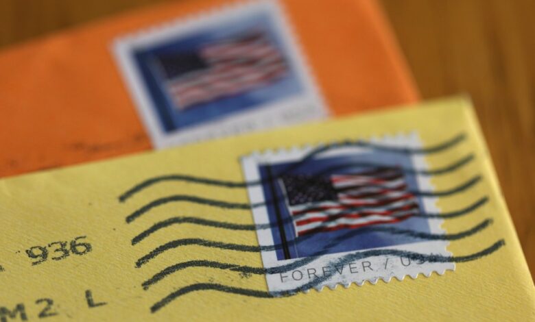 In this photo illustration, U.S. Postal Service (USPS) forever stamps are seen on envelopes on April 11, 2023 in San Anselmo, California