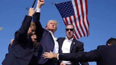 Republican presidential candidate former President Donald Trump is surrounded by U.S. Secret Service agents at a campaign rally, Saturday, July 13, 2024, in Butler, Pennsylvania.