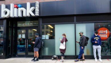 People queued outside Blink Fitness gym in Lower East Side neighborhood of New York, awaiting the lifting of mask requirements and vaccination mandates.