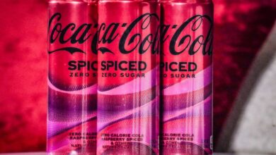 Cans of Coca-Cola Spiced being unveiled at a livestream media event in New York on February 6, 2024