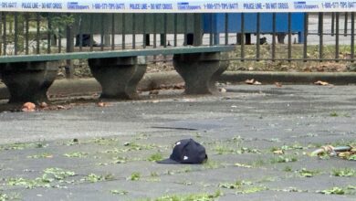 Crime scene on Lafayette Avenue near Franklin Avenue in Brooklyn showing a hat on the ground after a triple shooting