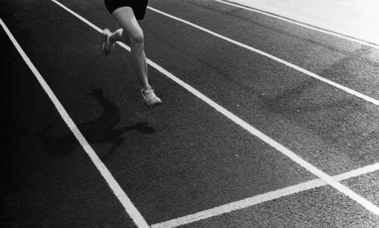 A runner crossing a finish line.