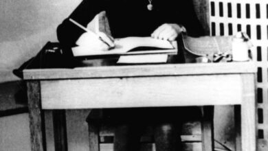 Undated photo of Anne Frank, the young Jewish girl, sitting at a desk