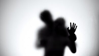 Silhouette of a loving couple hugging and kissing in the shower