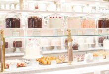 The Cake Bake Shop by Gwendolyn Rogers at Disney's BoardWalk in Orlando, displaying a variety of cakes and pastries