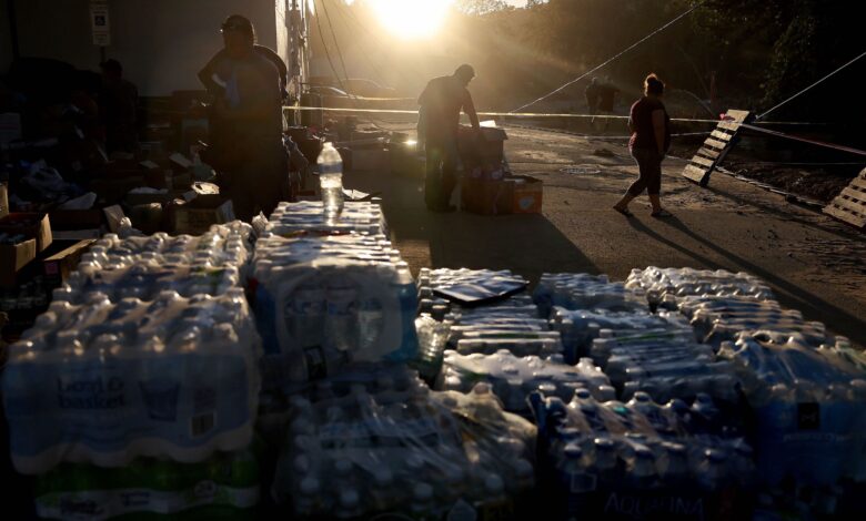 Volunteers gather water to distribute after Helene knocked out running water in North Carolina