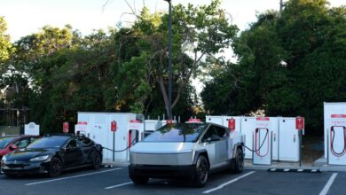 A Cybertruck charges at Tesla station.