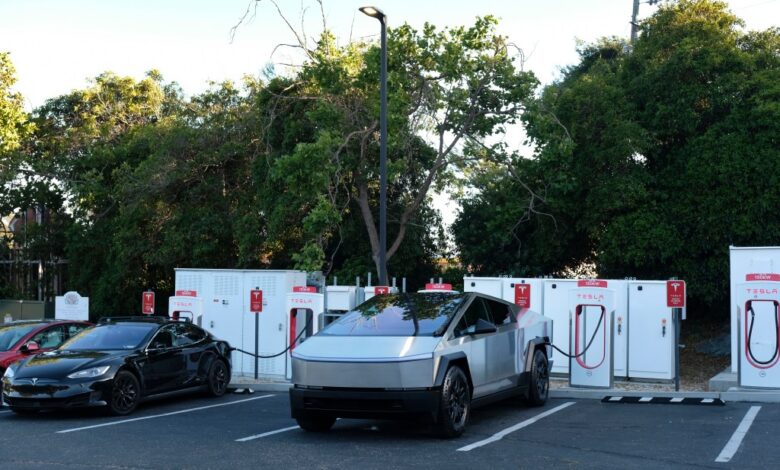 A Cybertruck charges at Tesla station.