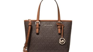 A brown and tan Michael Kors Jet Set handbag