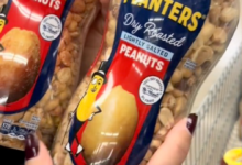 A person holding a bag of peanuts