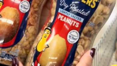 A person holding a bag of peanuts