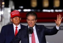 Former President Donald Trump looks on as then- Pennsylvania US Senate candidate Dr. Mehmet Oz  speaks at a pre-election rally in Latrobe, PA. on Nov. 5, 2022.