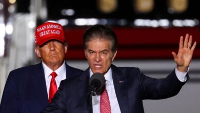 Former President Donald Trump looks on as then- Pennsylvania US Senate candidate Dr. Mehmet Oz  speaks at a pre-election rally in Latrobe, PA. on Nov. 5, 2022.